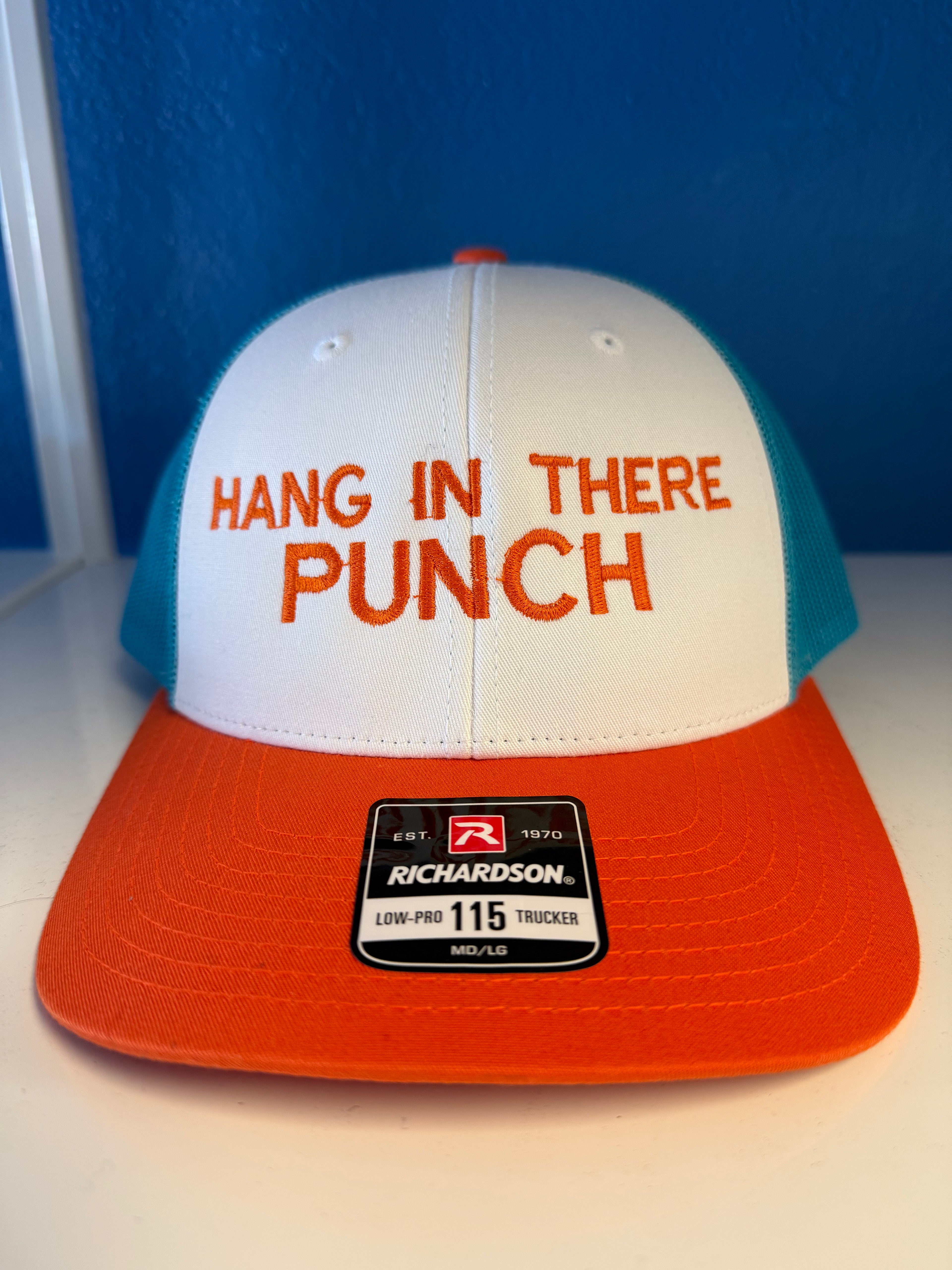 Hang In There Punch Trucker Hat